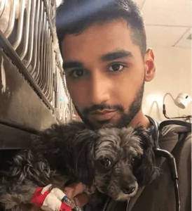 Aman Kanwar with dog patient in ER - I Love Veterinary