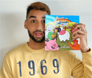 Aman Kanwar with his book 'Spot, the Baby Cow' - I Love Veterinary