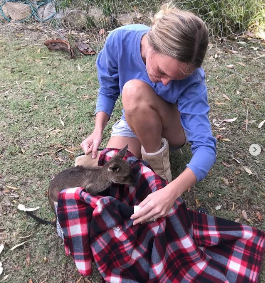 Dr. Chloe Buiting with a kangaroo baby in the balnket - I Love Veterianry