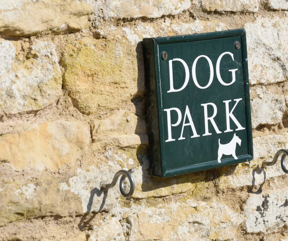 dog park sign against wall