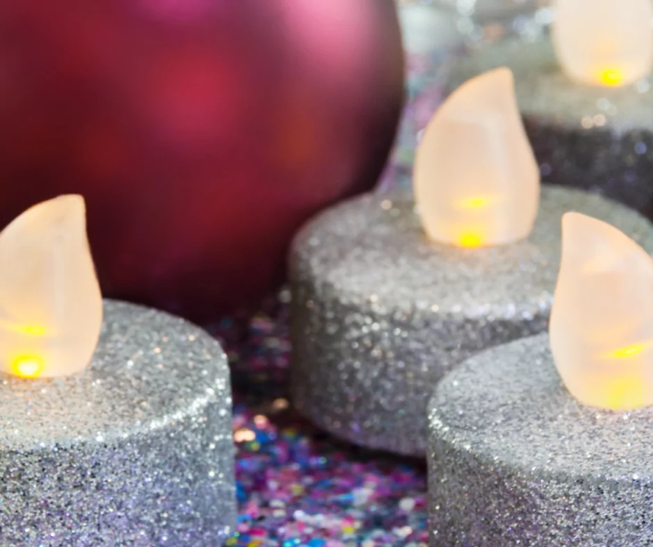three silver glitter LED candles