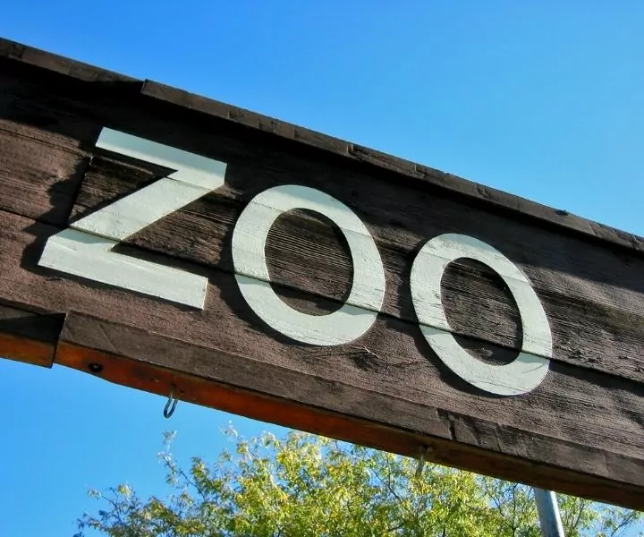 wooden zoo sign post