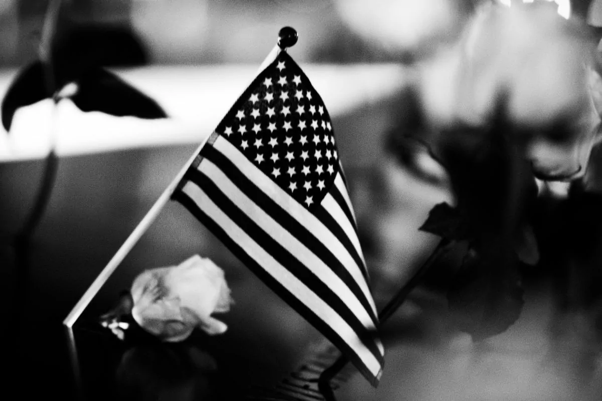 American Flag and white roses in monochrome